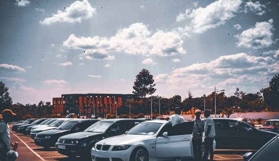 a group of cars parked in a parking lot